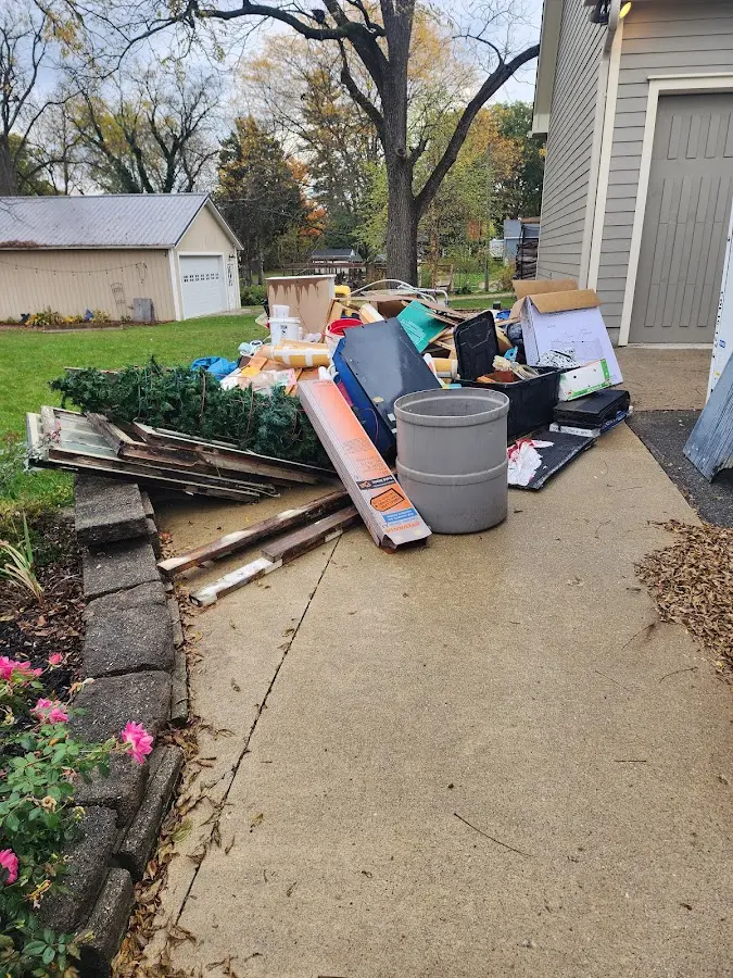 Dumpster being loaded with debris for 30 Yard Dumpster Rental in Grandview